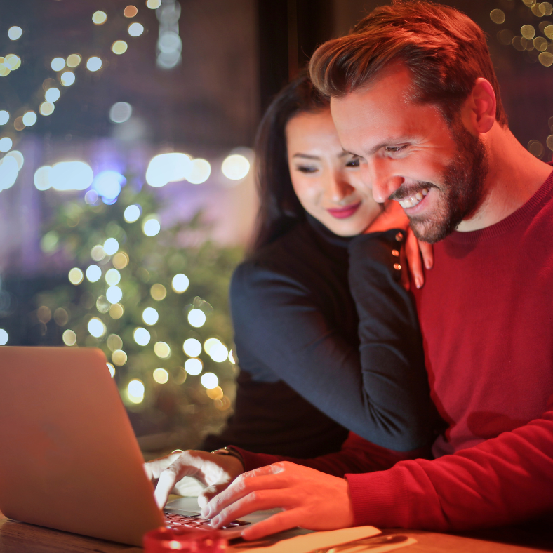 Couple Using Laptop
