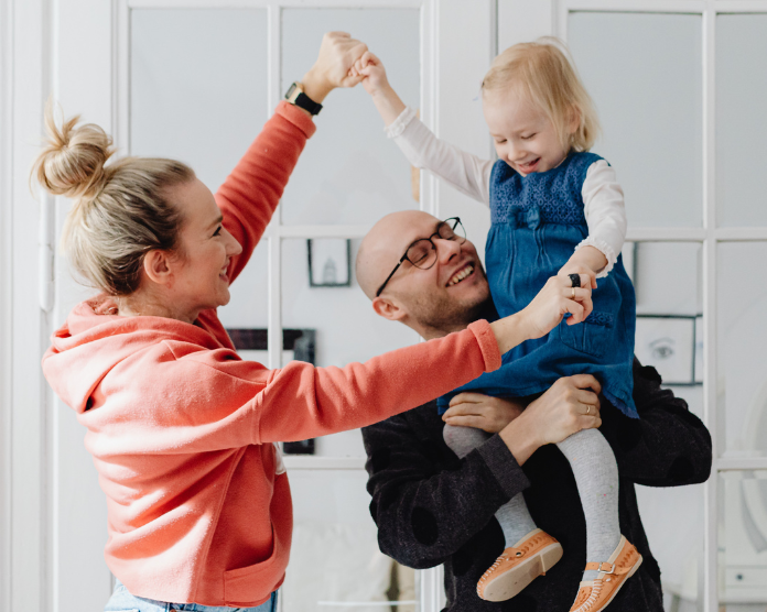 Mother and Father Holding Child