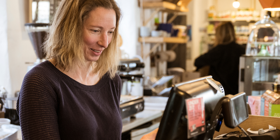 Woman Running a Cash Register