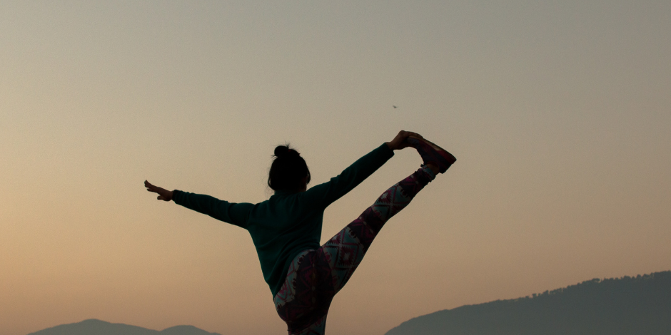 Woman Balancing on One Leg